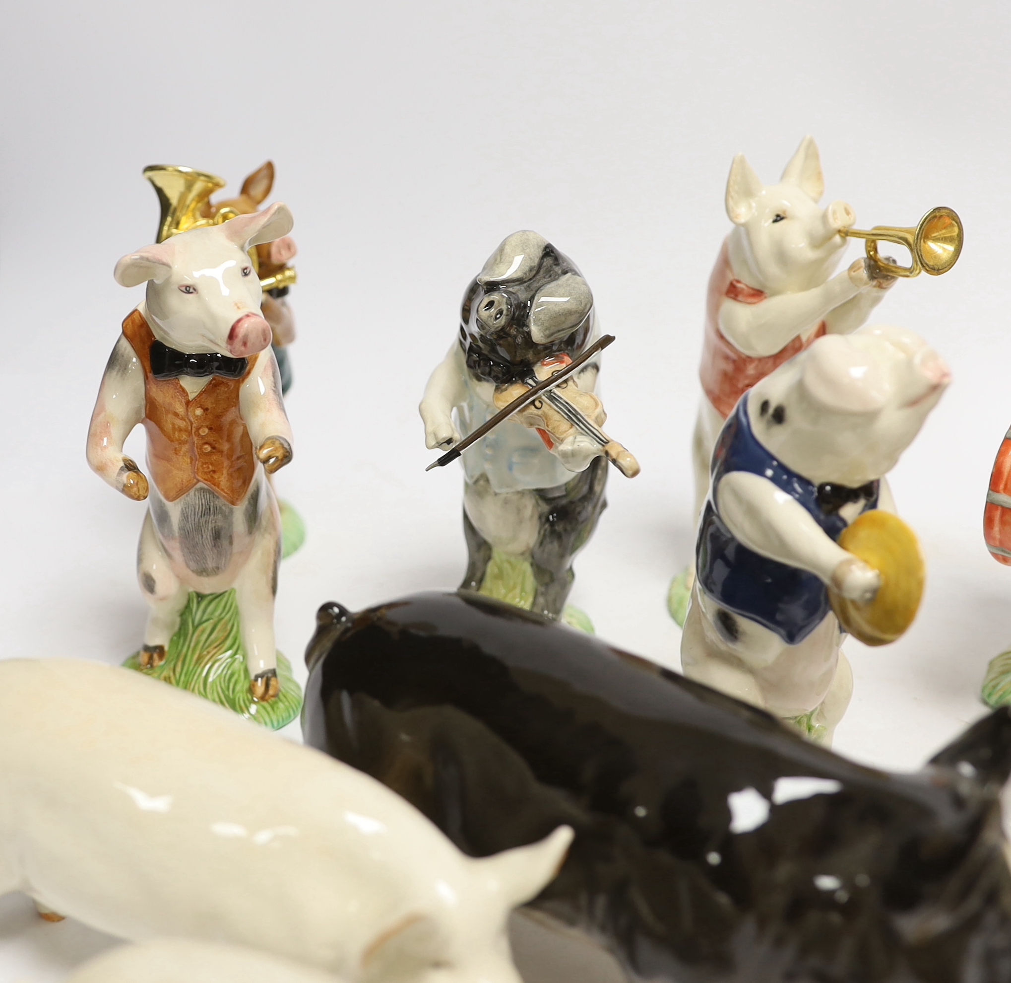 Five Beswick pigs and ten Beswick pig musician band figures